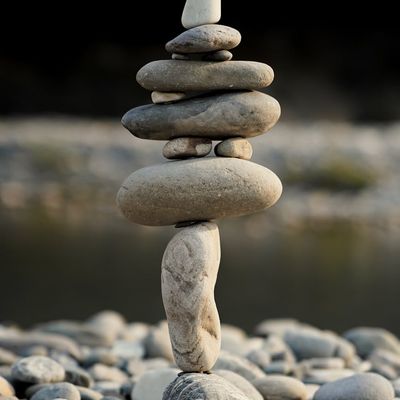 A stack of perfectly balanced dark stones.
