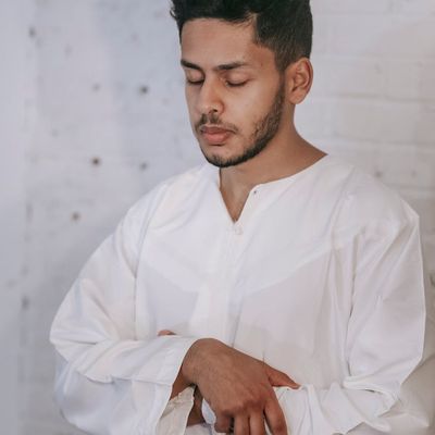 Close-up of hands in a focused, calm position.