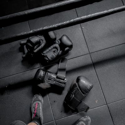 Empty, clean training mat on a dark floor.