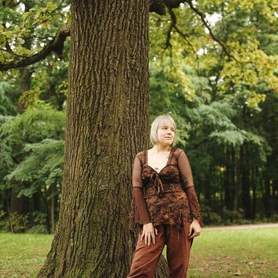 Person practicing deep breathing in a serene environment.